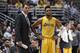 Los Angeles Lakers coach Luke Walton, left, talks with guard D'Angelo Russell during the second half of the team's NBA preseason basketball game against the Phoenix Suns in Anaheim, Calif., Friday, Oct. 21, 2016. (AP Photo/Kelvin Kuo)