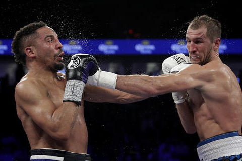 Sergey Kovalev, right, of Russia, throws a left at Andre Ward during their light heavyweight boxing match, Saturday, Nov. 19, 2016, in Las Vegas. (AP Photo/John Locher)