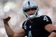 OAKLAND, CA - NOVEMBER 27: Derek Carr #4 of the Oakland Raiders celebrates after a touchdown by Latavius Murray #28 against the Carolina Panthers during their NFL game on November 27, 2016 in Oakland, California. (Photo by Lachlan Cunningham/Getty Images)