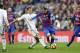 Barcelona's Lionel Messi, center right, escapes Real Madrid's Cristiano Ronaldo during the Spanish La Liga soccer match between FC Barcelona and Real Madrid at the Camp Nou in Barcelona, Spain, Saturday, Dec. 3, 2016. (AP Photo/Manu Fernandez)