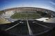 In this image taken with a fisheye lens, Sonny Lubick Field at Hughes Stadium is shown as players from Fresno State warm up before facing Colorado State in an NCAA college football game Saturday, Nov. 5, 2016, in Fort Collins, Colo. Colorado State will close Hughes Stadium after the team's final home game on Saturday, Nov. 19, when the Rams host New Mexico. The team will begin play in a new stadium built on campus in September 2017. (AP Photo/David Zalubowski)