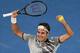 Roger Federer of Switzerland celebrates his victory over Rafael Nadal of Spain in the men's singles final on day 14 of the Australian Open tennis tournament in Melbourne on January 29, 2017. / AFP / SAEED KHAN / IMAGE RESTRICTED TO EDITORIAL USE - STRICTLY NO COMMERCIAL USE (Photo credit should read SAEED KHAN/AFP/Getty Images)