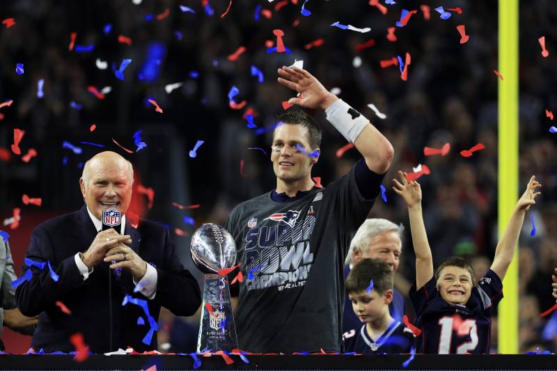 HOUSTON, TX - FEBRUARY 05:  Tom Brady #12 of the New England Patriots celebrates with the Vince Lombardi Trophy after defeating the Atlanta Falcons 34-28 in overtime to win Super Bowl 51 at NRG Stadium on February 5, 2017 in Houston, Texas.  (Photo by Mike Ehrmann/Getty Images)