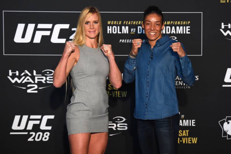BROOKLYN, NY - FEBRUARY 08: (L-R) Holly Holm and Germaine de Randamie of The Netherlands face off during the UFC 208 Ultimate Media Day at the Barclays Center on February 8, 2017 in Brooklyn, New York. (Photo by Jeff Bottari/Zuffa LLC/Zuffa LLC via Getty Images)
