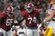 FILE - In this Sept. 3, 2016, file photo, Alabama offensive lineman Lester Cotton (66) and offensive lineman Cam Robinson (74) line up against Southern California during an NCAA college football game in Arlington, Texas. Robinson was selected to the 2016 AP All-America college football team, Monday, Dec. 12, 2016. (AP Photo/Tony Gutierrez, File)