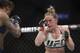 Holly Holm, right, fights Germaine de Randamie, of the Netherlands, during a women's featherweight championship mixed martial arts bout at UFC 208 Sunday, Feb. 12, 2017, in New York. de Randamie won the fight. (AP Photo/Frank Franklin II)