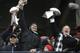 New England Patriots quarterback Tom Brady holds up Super Bowl trophies along with head coach Bill Belichick, right, and team owner Robert Kraft, left, during a rally Tuesday, Feb. 7, 2017, in Boston, to celebrate Sunday's 34-28 win over the Atlanta Falcons in the NFL Super Bowl 51 football game in Houston. (AP Photo/Elise Amendola)