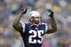 FOXBORO, MA - DECEMBER 29: Leonard Myers #25 of the New England Patriots tries to get the crowd into the game early against the Miami Dolphins at Gillette Stadium on December 29, 2002 in Foxboro, Massachusetts. The Patriots defeated the Dolphins 27-24 in overtime. (Photo by Ezra Shaw/Getty Images)