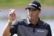 Ryan Palmer acknowledges the crowd as he finishes the second round of the Honda Classic golf tournament, Friday, Feb. 24, 2017, in Palm Beach Gardens, Fla. (AP Photo/Wilfredo Lee)