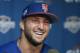 New York Mets outfielder and former NFL quarterback Tim Tebow laughs during a news conference at the baseball teams spring training facility in Port St. Lucie, Fla., Monday, Feb. 27, 2017. (AP Photo/John Bazemore)