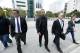 Chicago White Sox first baseman Jose Abreu, center, leaves federal court during a break, Wednesday, March 1, 2017 in Miami. Abreu has told a Miami federal jury he ate part of a fake passport while flying to the U.S. to cover up his illegal travel as part of a Cuban ballplayer smuggling operation. The testimony came in the trial of agent Bartolo Hernandez and trainer Julio Estrada, who are accused of alien smuggling and conspiracy. (AP Photo/Wilfredo Lee)