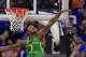 Oregon forward Jordan Bell (1) blocks a shot by Kansas guard Frank Mason III (0) during the first half of the Midwest Regional final of the NCAA men's college basketball tournament, Saturday, March 25, 2017, in Kansas City, Mo. (AP Photo/Orlin Wagner)