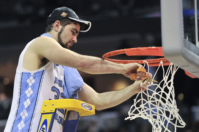 North Carolina forward Luke Maye cuts down the net after North Carolina beat Kentucky in the South Regional final game in the NCAA college basketball tournament Sunday, March 26, 2017, in Memphis, Tenn. Maye hit the winning basket that gave North Carolina a 75-73 win. (AP Photo/Brandon Dill)