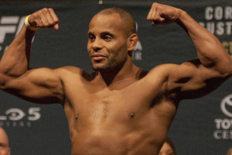 UFC fighter Daniel Cormier flexes his muscles during the weigh in for UFC 192, Friday, Oct. 2, 2015 in Houston. (AP Photo/Juan DeLeon)