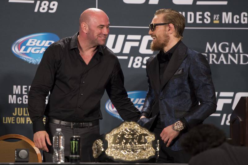 LAS VEGAS, NV - JULY 11: UFC President Dana White (L) and UFC interim featherweight champion Conor McGregor interact during the UFC 189 post fight press conference at the MGM Grand Garden Arena on July 11, 2015 in Las Vegas, Nevada. (Photo by Jeff Bottari/Zuffa LLC/Zuffa LLC via Getty Images)