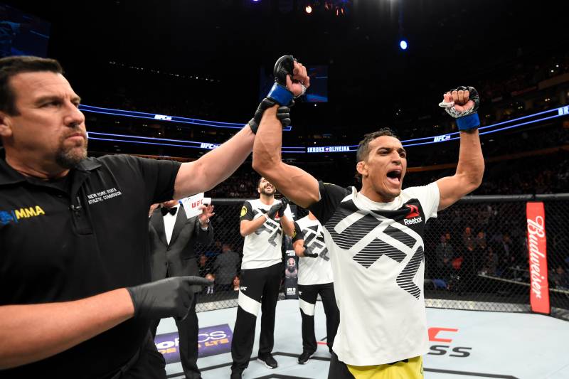 BUFFALO, NY - APRIL 08: Charles Oliveira of Brazil celebrates his rear choke submission victory against Will Brooks in their lightweight bout during the UFC 210 event at KeyBank Center on April 8, 2017 in Buffalo, New York. (Photo by Josh Hedges/Zuffa LLC/Zuffa LLC via Getty Images)