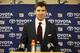 New York Giants quarterback Eli Manning peaks at a news conference after an NFC wild-card NFL football game against the Green Bay Packers, Sunday, Jan. 8, 2017, in Green Bay, Wis. The Packers won 38-13. (AP Photo/Matt Ludtke)