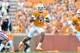 KNOXVILLE, TN - SEPTEMBER 12: Quarterback Josh Dobbs #11 of the Tennessee Volunteers gets chased out of the pocket during the first half of their game against the Oklahoma Sooners at Neyland Stadium on September 12, 2015 in Knoxville, Tennessee. (Photo by Jackson Laizure/Getty Images)