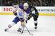 Edmonton Oilers center Connor McDavid (97) advances the puck as Los Angeles Kings center Trevor Lewis (22) defends in the third period of an NHL hockey game, Tuesday, April 4, 2017, in Los Angeles. The Kings won 6-4. (AP Photo/Michael Owen Baker)