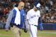TORONTO, ON - APRIL 13: Josh Donaldson #20 of the Toronto Blue Jays exits the game with trainer George Poulos after hitting an RBI double in the sixth inning during MLB game action against the Baltimore Orioles at Rogers Centre on April 13, 2017 in Toronto, Canada. (Photo by Tom Szczerbowski/Getty Images)