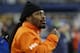 Former Seattle Seahawks running back Marshawn Lynch stands on the sidelines and chats with players on the bench in the second half of an NFL football game against the Carolina Panthers, Sunday, Dec. 4, 2016, in Seattle. (AP Photo/Ted S. Warren)