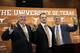 Tom Herman, center, poses with athletic director Mike Perrin, left, and school president Gregory Fenves, right, during a news conference where he was introduced at Texas' new head NCAA college football coach, Sunday, Nov. 27, 2016, in Austin. (AP Photo/Eric Gay)