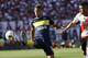 Boca Juniors' midfielder Rodrigo Bentancur, left, kicks the ball next to River Plate's defender Jorge Moreira during their Argentine soccer derby in Buenos Aires, Argentina, Sunday, Dec. 11, 2016. (AP Photo/Victor R. Caivano)