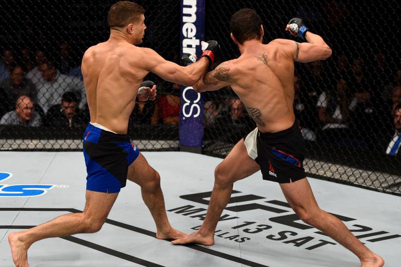 NASHVILLE, TN - APRIL 22: (L-R) Al Iaquinta knocks down Diego Sanchez with a right in their lightweight bout during the UFC Fight Night event at Bridgestone Arena on April 22, 2017 in Nashville, Tennessee. (Photo by Jeff Bottari/Zuffa LLC/Zuffa LLC via Getty Images)