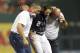 Washington Nationals' Adam Eaton (2) is carried off the field after he was injured during the ninth inning of a baseball game against the New York Mets, Friday, April 28, 2017, in Washington. (AP Photo/Nick Wass)