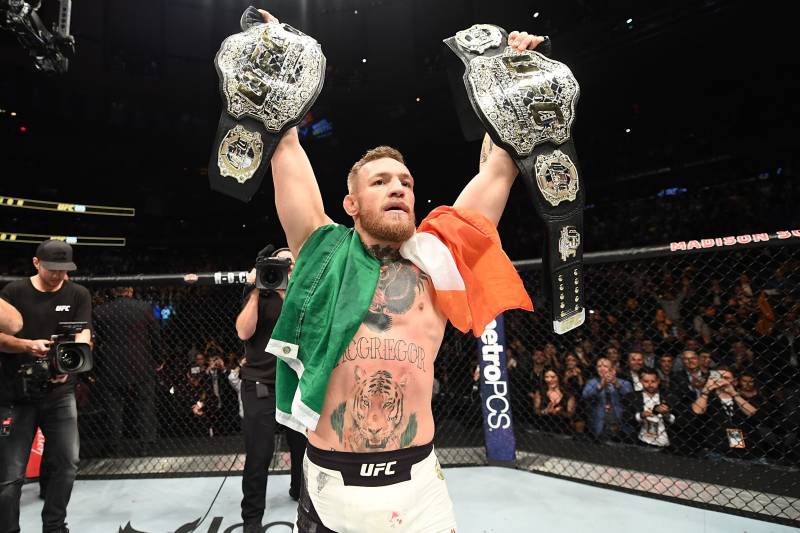 NEW YORK, NY - NOVEMBER 12: UFC lightweight and featherweight champion Conor McGregor of Ireland celebrates after defeating Eddie Alvarez in their UFC lightweight championship fight during the UFC 205 event at Madison Square Garden on November 12, 2016 in New York City. (Photo by Jeff Bottari/Zuffa LLC/Zuffa LLC via Getty Images)