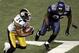 Pittsburgh Steelers cornerback Ike Taylor heads downfield after pulling in an interception thrown by Seattle Seahawks quarterback Matt Hasselbeck during the fourth quarter of the Super Bowl XL football game, Sunday, Feb. 5, 2006, in Detroit. At right is S
