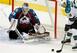 Colorado Avalanche goalie Jean-Sebastien Giguere (35) covers the net to make a save on a shot by San Jose Sharks' Patrick Marleau (12) during the third period of an NHL hockey game on Sunday Nov. 20, 2011, in Denver. The Sharks won 4-1. (AP Photo/Barry Gu