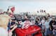 New Jersey Devils Bruce Driver reaches out to fans during a motorcade around the Meadowlands Arena in East Rutherford, N.J., to celebrate the Stanley Cup champions on Wednesday, June 28, 1995. (AP Photo/Mike Derer)