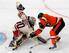 New York Rangers' Henrik Lundqvist (30), of Sweden, blocks a shot by Philadelphia Flyers' Claude Giroux (28) in the first period of the NHL Winter Classic hockey game, Monday, Jan. 2, 2012, in Philadelphia. (AP Photo/Mel Evans)