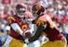 QB Cody Kessler handing off to Justin Davis.