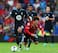 Mousa Dembele outmuscles Kim Bo-Kyung.