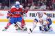 Montreal Canadiens forward David Desharnais in front of New York Islanders goalie Evgeni Nabokov.