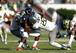 Rodney Hardrick and Derrick Malone team up for a tackle.