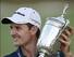 Justin Rose poses with the U.S. Open Trophy.
