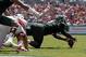 USF's Todd Chandler recovers one of Miami's two fumbles.