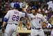 Marlon Byrd is congratulated by Ike Davis.