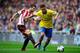 Keeping his eyes on the ball: Ozil and Arsenal have attempted the fewest long balls so far this season