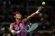 Li Na prepares to serve at the China Open.