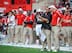 Pelini (right) may not be walking those sidelines for long if he doesn't switch it up.