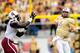 Jadeveon Clowney (left) closes in on UCF quarterback Blake Bortles.