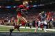 Vernon Davis scores a touchdown against the Rams.