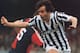 Michel Platini battles against Genoa for Juventus.