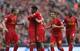 Lucas celebrates with his Liverpool teammates.