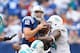 Cameron Wake, seen here helping teammate Randy Starks sack Indianapolis Colts quarterback Andrew Luck in Week 2, is one of five Dolphins defensive starters battling injury right now.