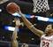 Mar 30, 2013; Los Angeles, CA, USA; Ohio State Buckeyes center Amir Williams (23) defends against Wichita State Shockers guard Tekele Cotton (32)during the first half of the finals of the West regional of the 2013 NCAA tournament at the Staples Center. Ma